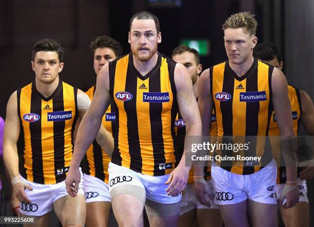 Jarryd Roughead of the Hawks leads his team out onto the field during the round 16 AFL match between the Western Bulldogs and the Hawthorn Hawks at...