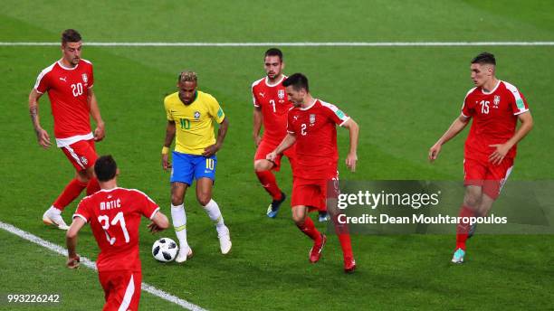 Neymar of Brazil is surrounded by Sergej Milinkovic-Savic, Andrija Zivkovic, Antonio Rukavina, Nikola Milenkovic and Nemanja Matic of Serbia during...