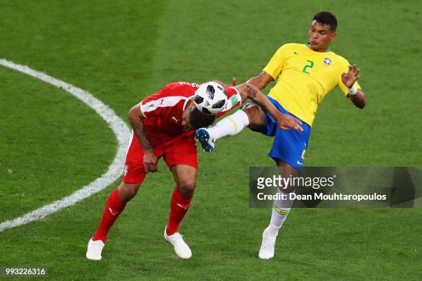 Thiago Silva of Brazil kicks the ball and the head of Aleksandar Mitrovic of Serbia during the 2018 FIFA World Cup Russia group E match between...