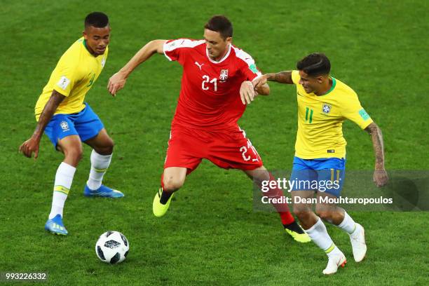 Nemanja Matic of Serbia battles for the ball with Philippe Coutinho and Gabriel Jesus of Brazil during the 2018 FIFA World Cup Russia group E match...