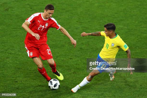 Nemanja Matic of Serbia battles for the ball with Philippe Coutinho of Brazil during the 2018 FIFA World Cup Russia group E match between Serbia and...
