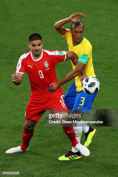 Aleksandar Mitrovic of SerbMame Biram Diouf battles for the ball with Miranda of Brazil during the 2018 FIFA World Cup Russia group E match between...