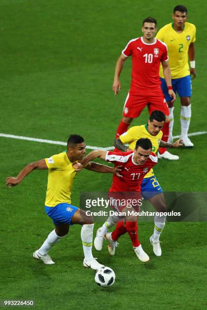 Filip Kostic of Serbia battles for the ball with Casemiro and Fagner of Brazil during the 2018 FIFA World Cup Russia group E match between Serbia and...