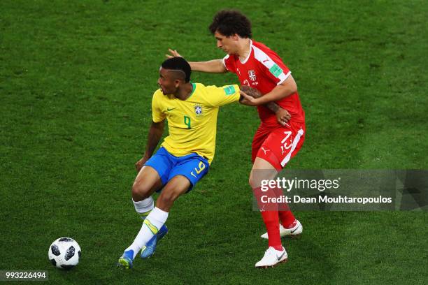 Gabriel Jesus of Brazil battles for the ball with Milos Veljkovic of Serbia during the 2018 FIFA World Cup Russia group E match between Serbia and...