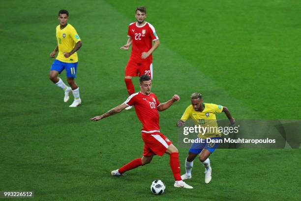 Neymar of Brazil gets past the tackle from Sergej Milinkovic-Savic of Serbia during the 2018 FIFA World Cup Russia group E match between Serbia and...