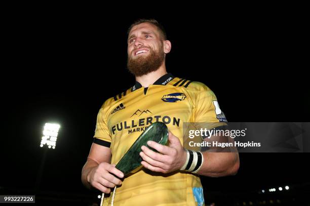 Brad Shields of the Hurricanes poses with his pounamu mere, gifted in recognition of his 100th Super Rugby game during the round 18 Super Rugby match...