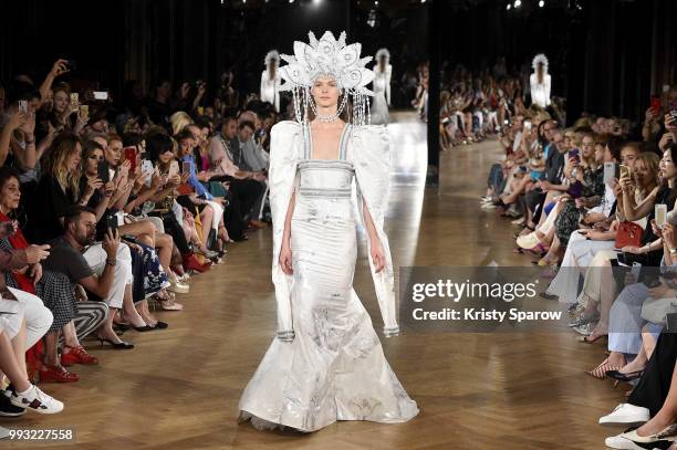 Model walks the runway during the Yanina Couture Haute Couture Fall Winter 2018/2019 show as part of Paris Fashion Week on July 3, 2018 in Paris,...