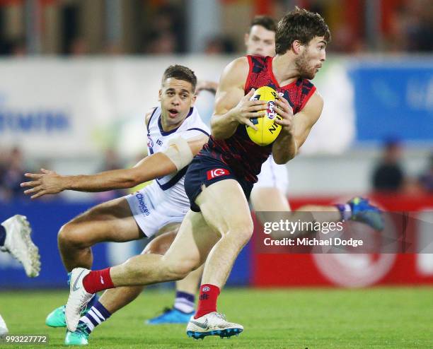 Jack Viney of the Demons runs with the ball during the round 16 AFL match between the Melbourne Demons and the Fremantle Dockers at TIO Stadium on...