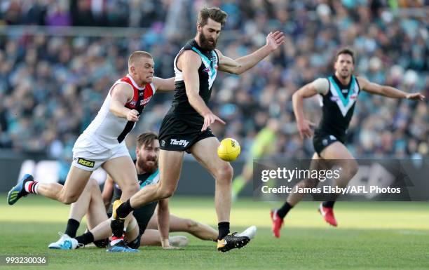 Sebastian Ross of the Saints tackles Justin Westhoff of the Power during the 2018 AFL round 16 match between the Port Adelaide Power and the St Kilda...