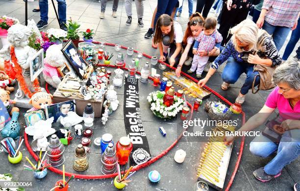 Demonstrators gather near candles and messages in tribute to David Dragicevic in Banja Luka city center, on July 3, 2018 during the 100th day of a...