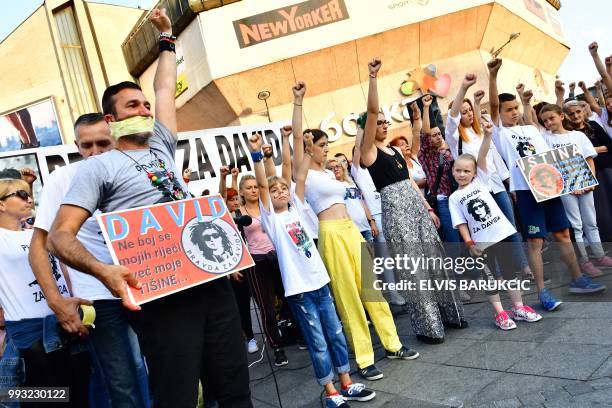 Davor Dragicevic , father of a student found dead in a stream in March, protests with duct tape over his mouth during the 100th day of a...