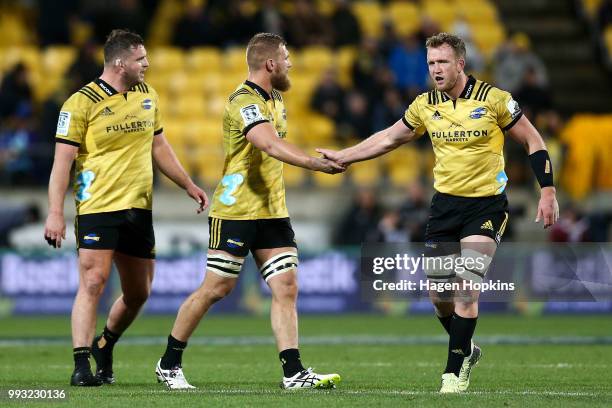 Fraser Armstrong, Brad Shields, and Gareth Evans of the Hurricanes look on during the round 18 Super Rugby match between the Hurricanes and the Blues...