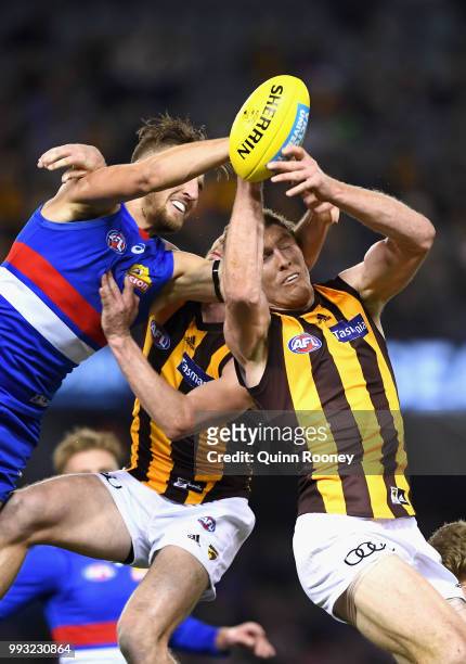 Ben McEvoy of the Hawks marks infront of Marcus Bontempelli of the Bulldogs during the round 16 AFL match between the Western Bulldogs and the...