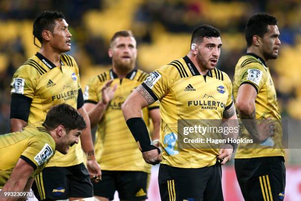 To R, Sam Lousi, Brad Shields, Jeff Toomaga-Allen and Vaea Fifita of the Hurricanes look on during the round 18 Super Rugby match between the...