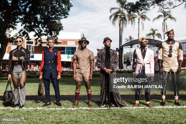 People present creations by local designers during a fashion show at the 2018 editon of the Vodacom Durban July horse race in Durban, on July 6,...