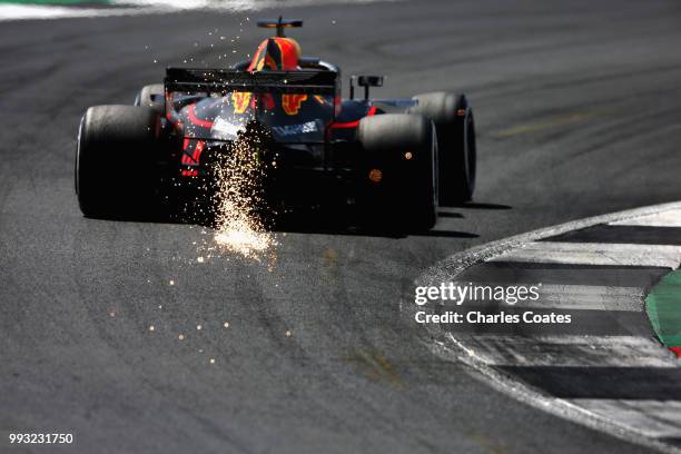 Sparks fly behind Daniel Ricciardo of Australia driving the Aston Martin Red Bull Racing RB14 TAG Heuer on track during final practice for the...