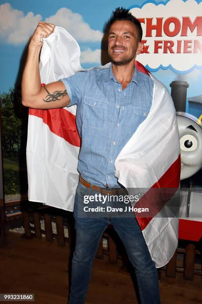 Peter Andre holds up the England flag at the UK premiere of 'Thomas The Tank Engine: Big World! Big Adventures! - The Movie' at Vue West End on July...