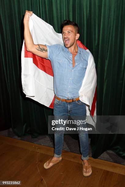 Peter Andre holds up the England flag at the UK premiere of 'Thomas The Tank Engine: Big World! Big Adventures! - The Movie' at Vue West End on July...