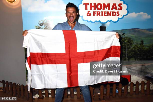 Peter Andre holds up the England flag at the UK premiere of 'Thomas The Tank Engine: Big World! Big Adventures! - The Movie' at Vue West End on July...