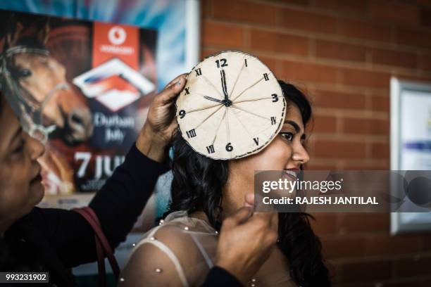 Model presents a creation by local designers during a fashion show at the 2018 editon of the Vodacom Durban July horse race in Durban, on July 6,...