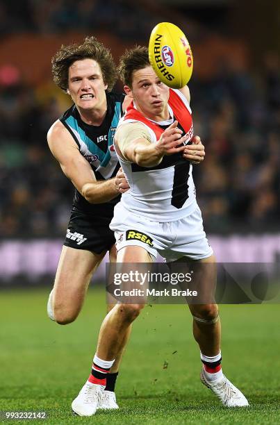 Jack Billings of the Saints under pressure from Jared Polec of Port Adelaide during the round 16 AFL match between the Port Adelaide Power and the St...