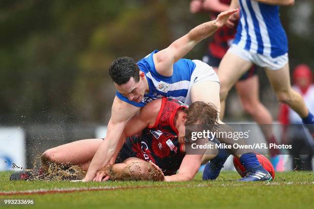 Patrick Mckenna of the Demons is tackled during the round 14 VFL match between Casey and North Melbourne at Casey Fields on July 7, 2018 in...
