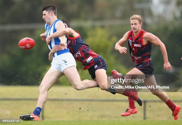 Tyrone Leonardis of the Kangaroos is tackled during the round 14 VFL match between Casey and North Melbourne at Casey Fields on July 7, 2018 in...