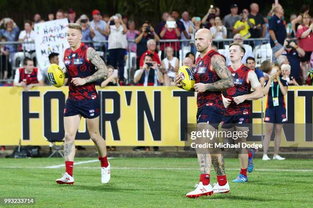 Nathan Jones of the Demons of the Demons leads the team out during the round 16 AFL match between the Melbourne Demons and the Fremantle Dockers at...