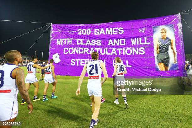Stephen Hill of the Dockers walks out for his 2ooth match during the round 16 AFL match between the Melbourne Demons and the Fremantle Dockers at TIO...