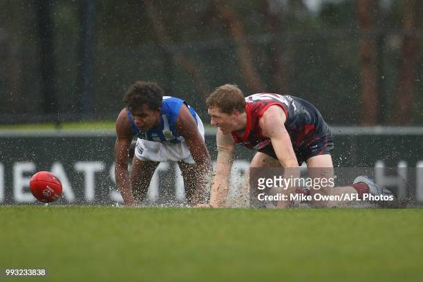 Declan Keilty of the Demons and Gordon Narrier of the Kangaroos compete for the ball during the round 14 VFL match between Casey and North Melbourne...