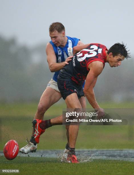 Samuel Weideman of the Demons and Benjamin Mckay of the Kangaroos compete for the ball during the round 14 VFL match between Casey and North...