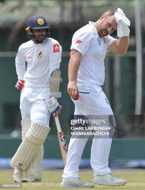 Shaun von Berg of South Africa wipes his face during the opening day of a two-day practice match between the Sri Lanka Board XI and South African...