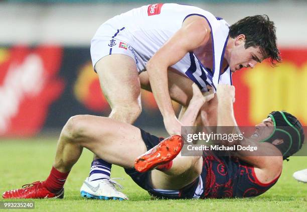 Andrew Brayshaw of the Dockers wrestles on top of brother Angus Brayshaw of the Demons after a contest during the round 16 AFL match between the...