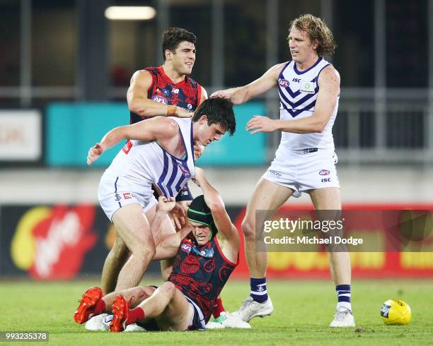 Andrew Brayshaw of the Dockers wrestles on top of brother Angus Brayshaw of the Demons after a contest during the round 16 AFL match between the...