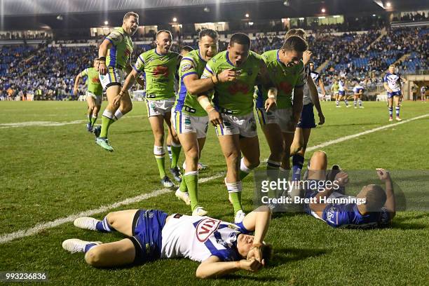 Joseph Leilua of the Raiders celebrates scoring a try with team mates during the round 17 NRL match between the Canterbury Bulldogs and the Canberra...