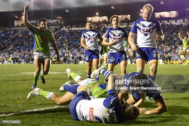 Joseph Leilua of the Raiders scores a try during the round 17 NRL match between the Canterbury Bulldogs and the Canberra Raiders at Belmore Sports...