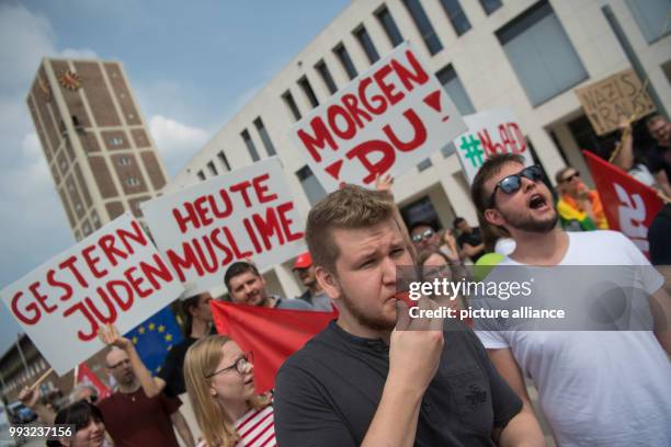 July 2018, Germany, Kornwestheim: People at the Marktplatz taking part in a counter-protest against an AfD demonstration. Around 100 people took part...