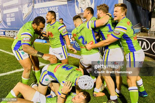 Raiders players celebrate victory during the round 17 NRL match between the Canterbury Bulldogs and the Canberra Raiders at Belmore Sports Ground on...
