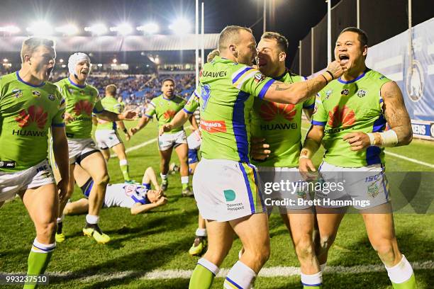 Raiders players celebrate victory during the round 17 NRL match between the Canterbury Bulldogs and the Canberra Raiders at Belmore Sports Ground on...