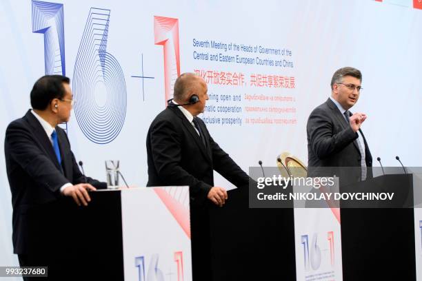 Chinese Premier Li Keqiang and Bulgarian Prime minister Boyko Borisov listen to Croatia's Prime Minister Andrej Plenkovica during a press conference...