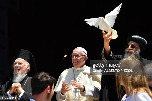 Pope Francis and Ecumenic Patriarch of the Orthodox Church Bartolomeo I watch as Egypt's Coptic Orthodox Pope Tawadros II releases a dove after a...
