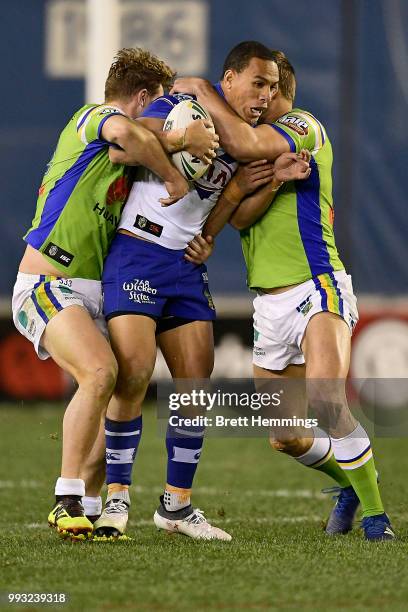 William Hopoate of the Bulldogs is tackled during the round 17 NRL match between the Canterbury Bulldogs and the Canberra Raiders at Belmore Sports...