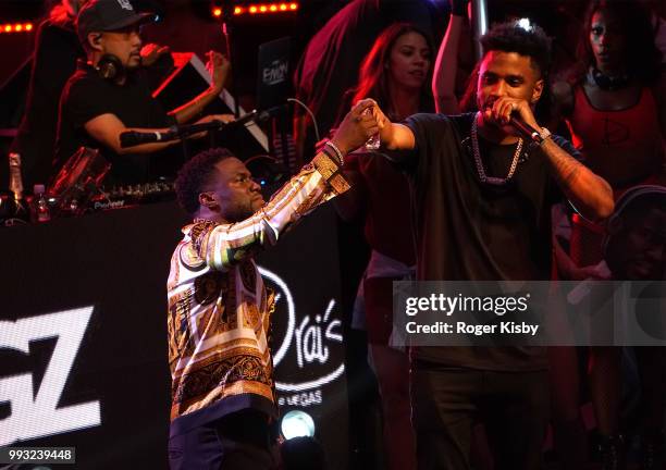 Actor/comedian Kevin Hart and recording artist Trey Songz toast to Hart's birthday onstage during Hart's birthday party at Drai's Beach Club -...