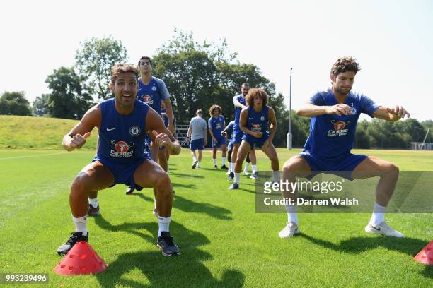 Cesc Fabregas and Marcos Alonso of Chelsea during a training session at Chelsea Training Ground on July 7, 2018 in Cobham, England.