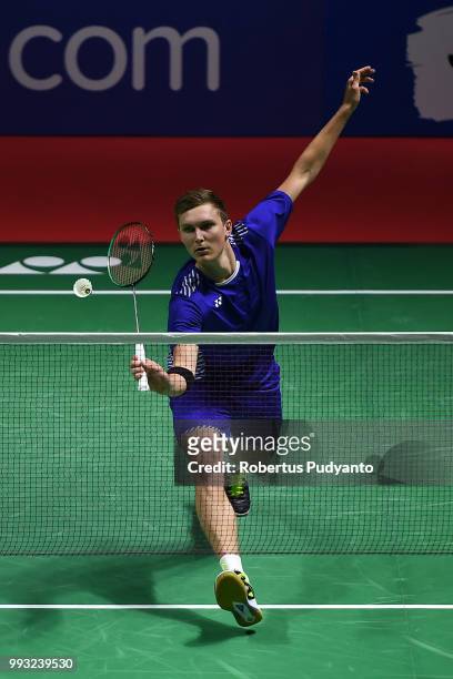 Viktor Axelsen of Denmark competes against Shi Yuqi of China during the Men's Singles Semi-final match on day five of the Blibli Indonesia Open at...