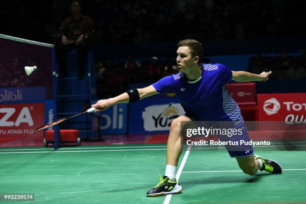 Viktor Axelsen of Denmark competes against Shi Yuqi of China during the Men's Singles Semi-final match on day five of the Blibli Indonesia Open at...