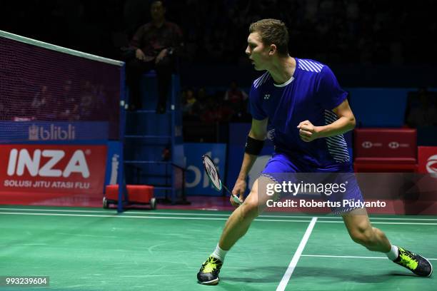 Viktor Axelsen of Denmark competes against Shi Yuqi of China during the Men's Singles Semi-final match on day five of the Blibli Indonesia Open at...