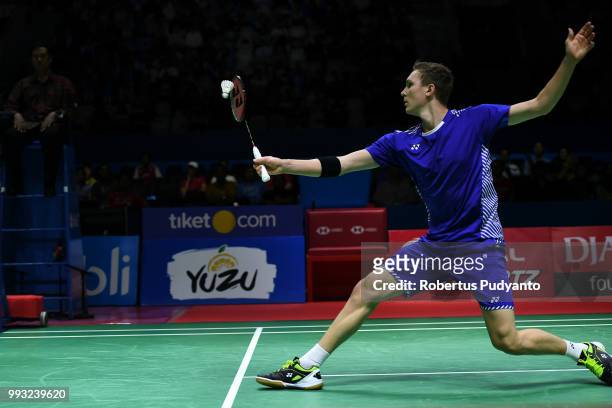 Viktor Axelsen of Denmark competes against Shi Yuqi of China during the Men's Singles Semi-final match on day five of the Blibli Indonesia Open at...
