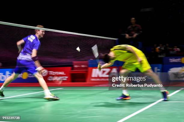 Viktor Axelsen of Denmark competes against Shi Yuqi of China during the Men's Singles Semi-final match on day five of the Blibli Indonesia Open at...