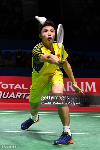 Shi Yuqi of China competes against Viktor Axelsen of Denmark during the Men's Singles Semi-final match on day five of the Blibli Indonesia Open at...